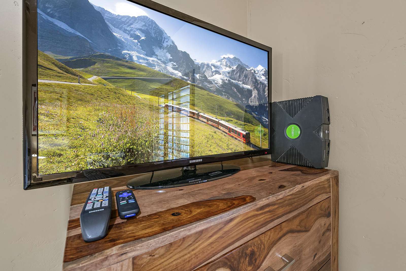 Twin bedroom has tv with Xbox and a large variety of games