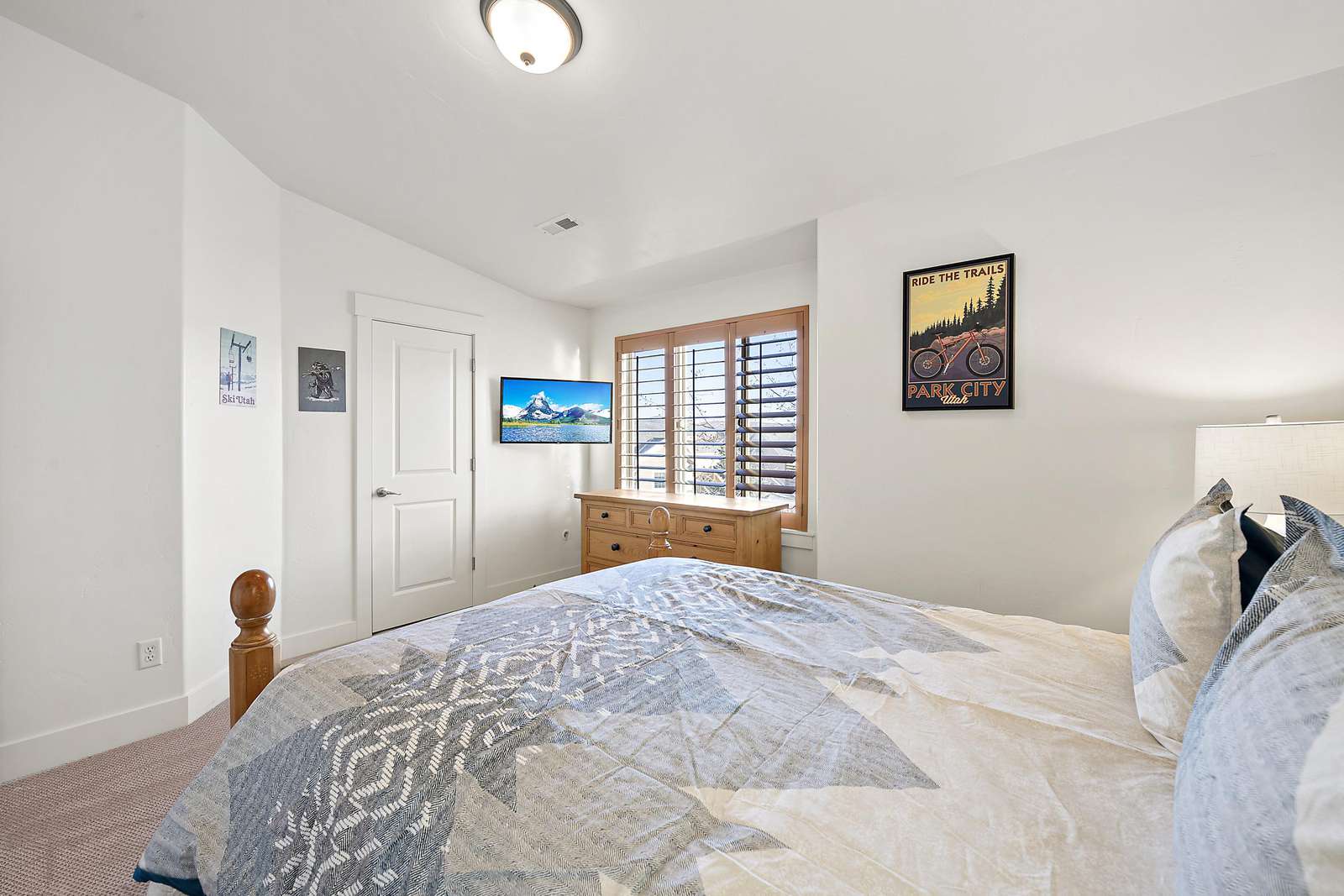 Guest bedroom with dresser and closet