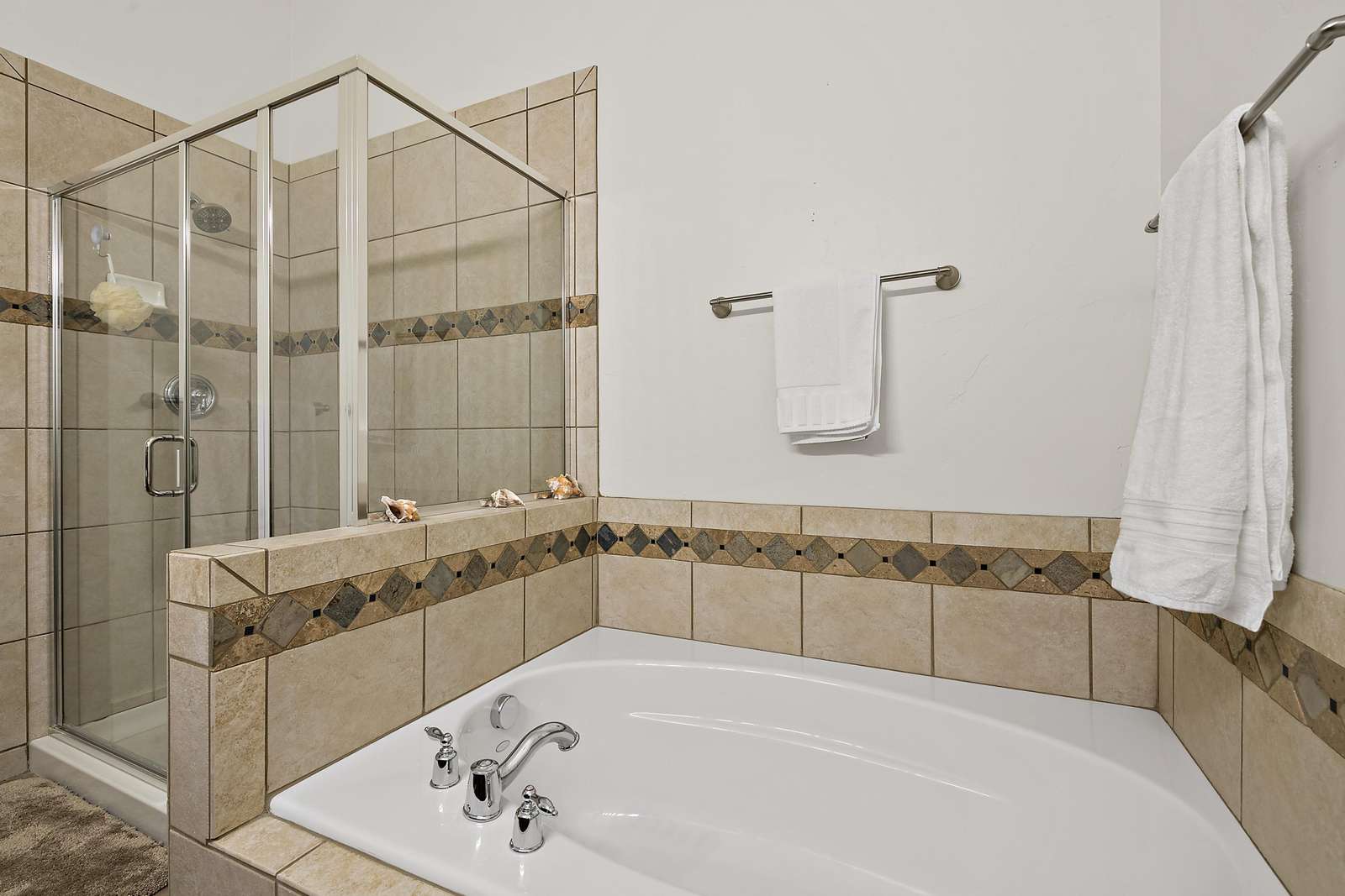 Master bathroom with separate tub and shower