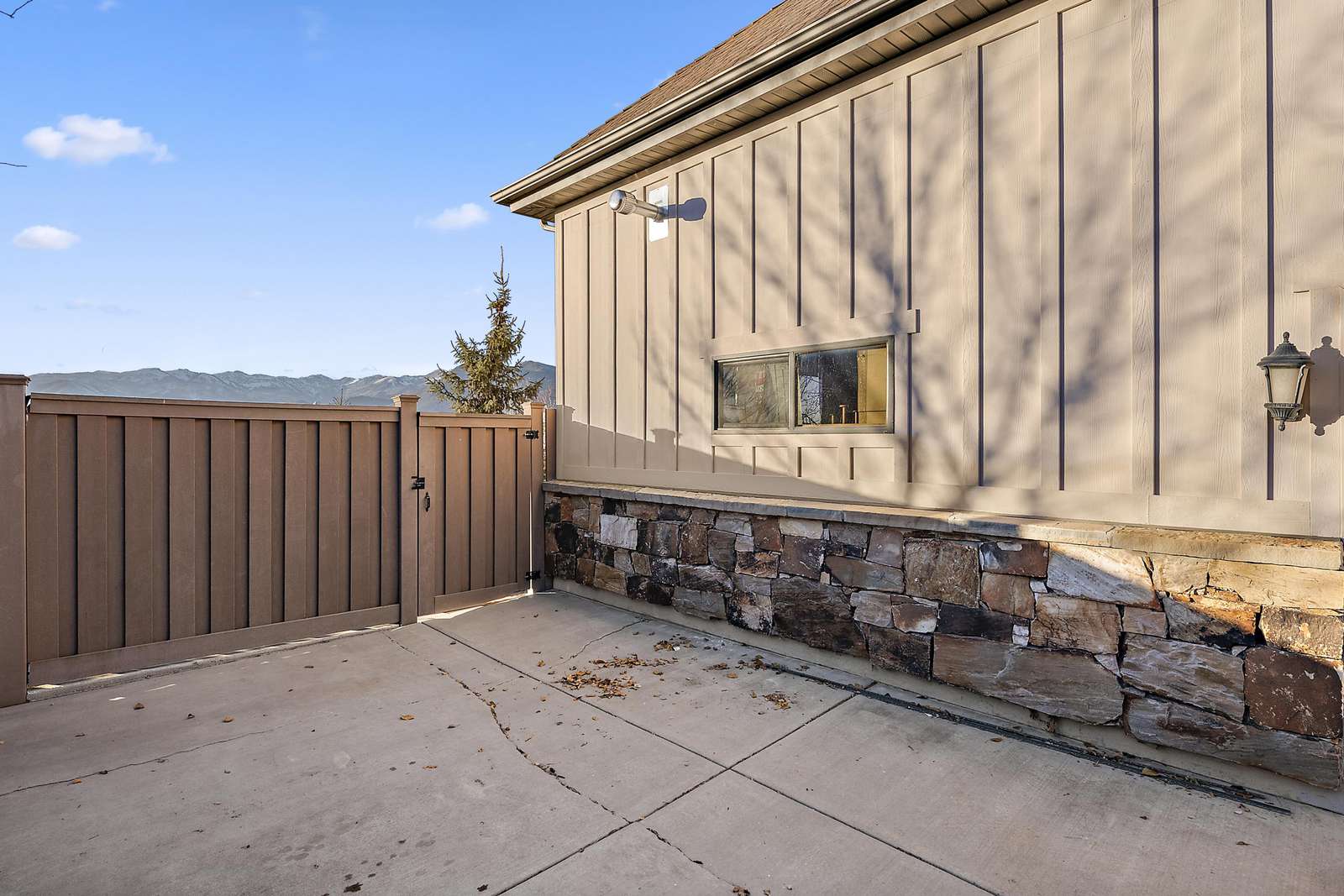 Entrance gate accessed on the side of the home