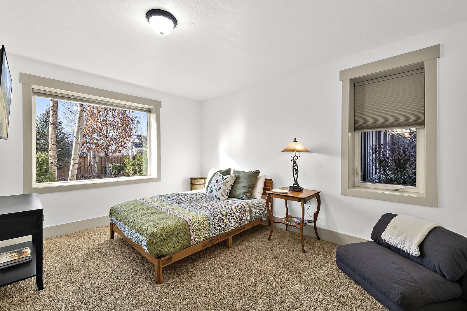 Guest bedroom with window views