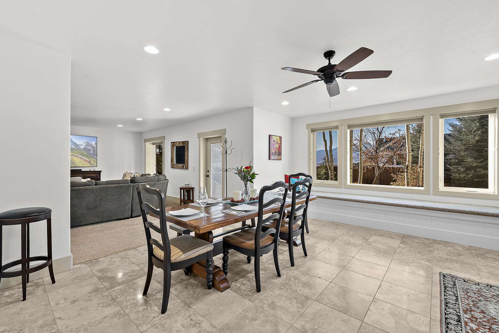Dining area near large windows and bench seating