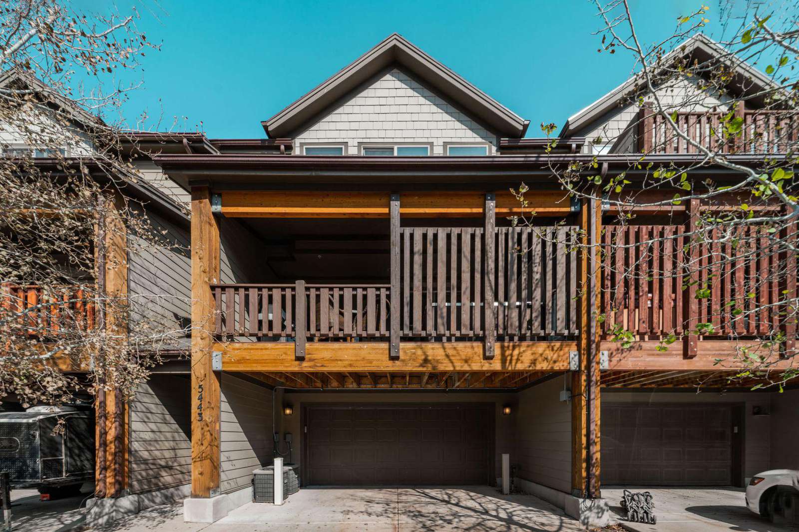 View of garage and deck