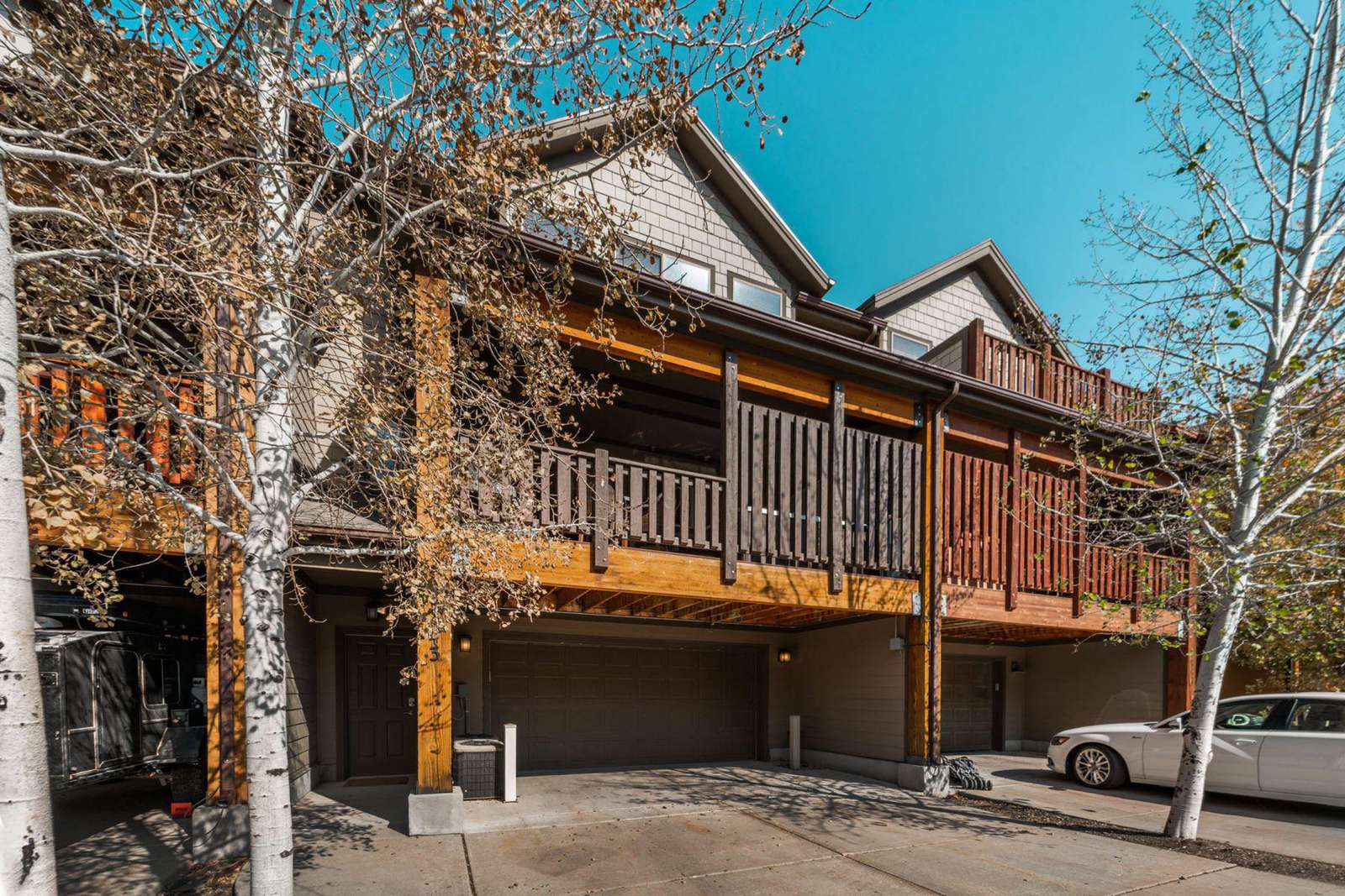 View of garage and deck