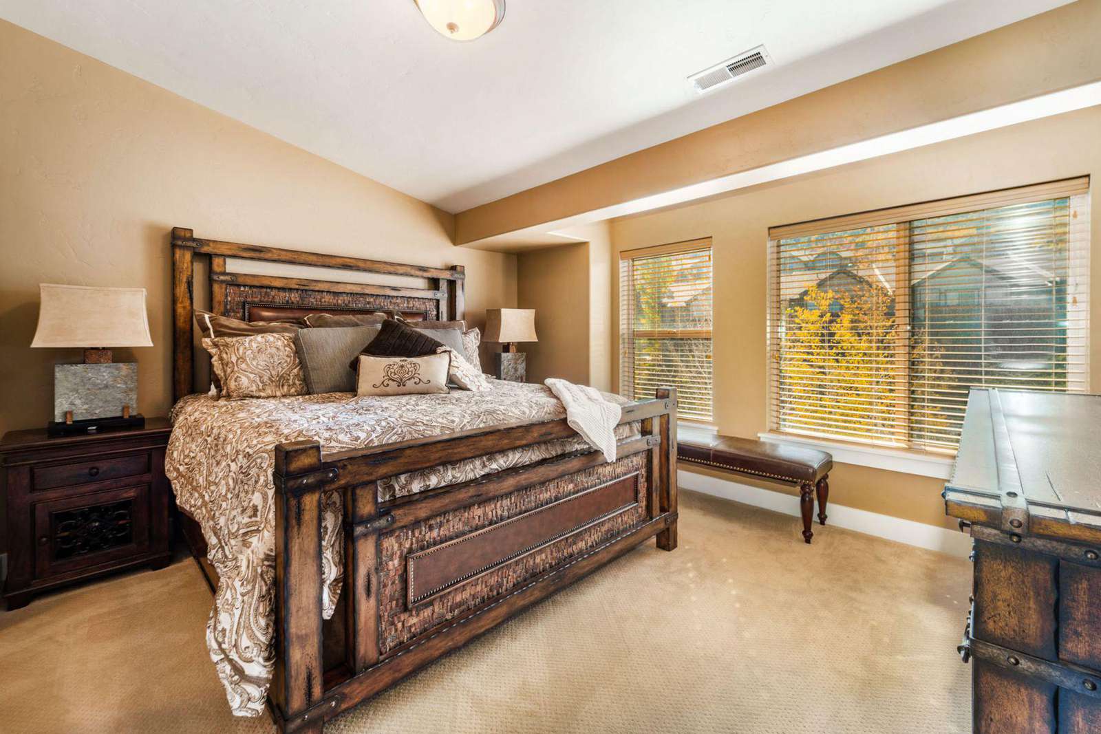 Master bedroom equipped with window views